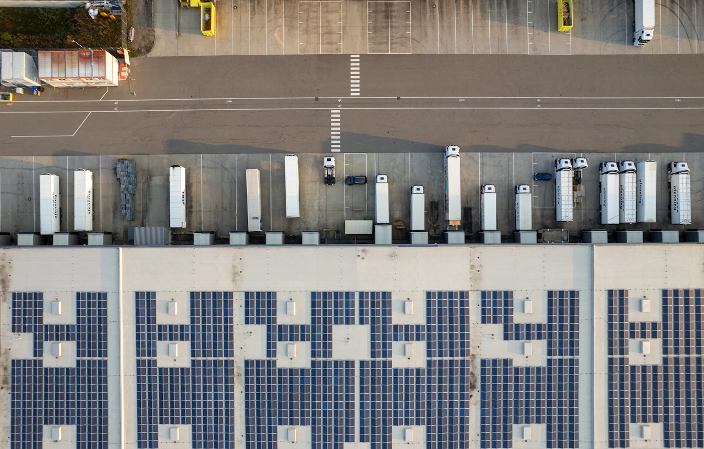Aerial view of heavy goods vehicles at the docks of a logistics platform